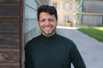 Obraz premium Handsome bearded man wearing an elegant turtle neck sweater 