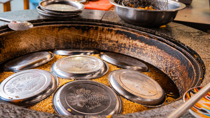 traditional oriental Arabic Uzbek pilaf with meat in a cauldron. Central Asian Pilaf Center in Uzbekistan in Tashkent