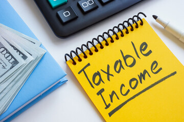 Notebook entry with taxable income.