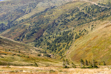 Naklejka premium view of the mountain couloir from the top of the ridge, mountain valley