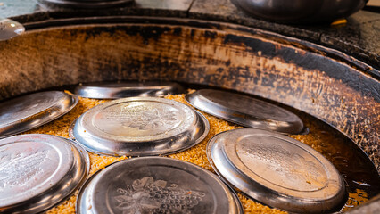 The concept of oriental cuisine. Assorted Uzbek food set, pilaf, samsa, lagman, manta, shurpa central asia food. Homemade Uzbek pilaf or plov from lamb served in cast iron cookware