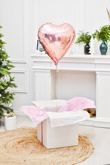 Present box with red ribbon and balon for christmas © Anton