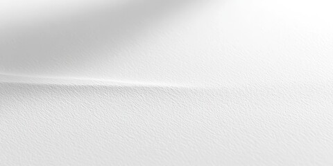 A close-up of textured white paper, showcasing subtle lines and shadows.