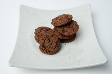 Chocolate chip cookies stacked on a plate