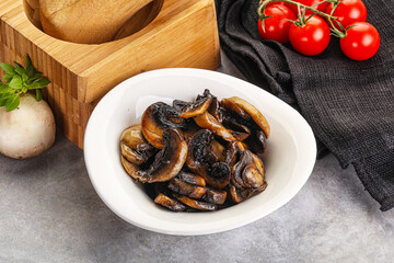 Roasted champignon mushrooms in the bowl