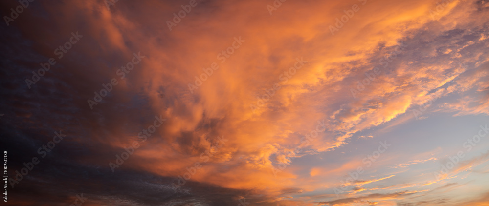 Wall mural beautiful,dramatic sky illuminated by the sun during sunset-panorama
