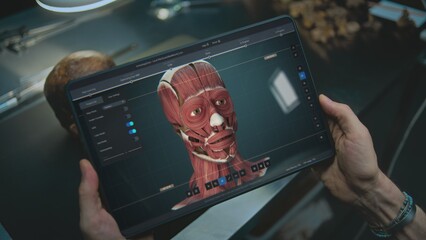 Advanced archaeological lab: Archaeologist scans fossil skull through camera using tablet computer,...