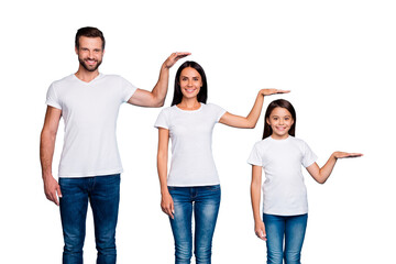Obraz premium Portrait of charming family holding palm wearing white t-shirt denim jeans isolated over blue background