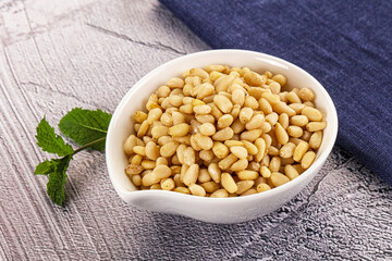 Peeled cedar nut in the bowl