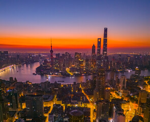 Obraz premium Aerial view of modern city skyline and buildings at sunrise in Shanghai