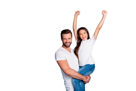 Portrait of cheerful person holding schoolkid raising her fists screaming yeah celebrating victory wearing white t-shirt denim jeans isolated over blue background