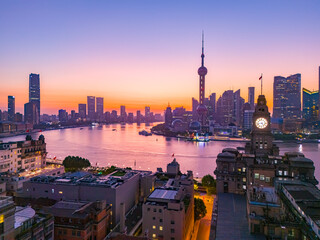 Aerial view of modern city skyline and buildings at sunrise in Shanghai