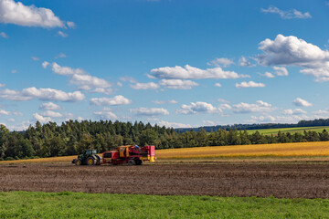 Tractor on field. Early autumn.