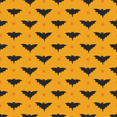 Halloween seamless pattern with bats and stars on yellow background. Perfect for wallpaper, gift paper, autumn greeting cards. Vector illustration