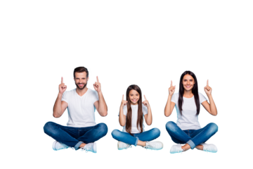 Full length body size photo of fascinating cheerful charming casual family pointing up for you to see something sitting with legs crossed while isolated with blue background with copyspace