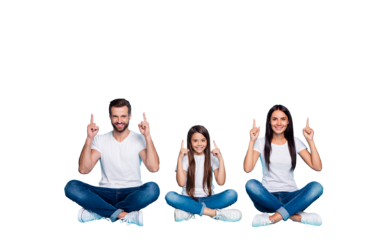 Full length body size photo of fascinating cheerful charming casual family pointing up for you to see something sitting with legs crossed while isolated with blue background with copyspace