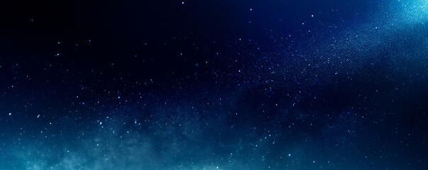 Obraz premium Dark blue background with glowing lights and bokeh, creating an atmosphere of mystery and magic.
