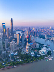 Aerial view of modern city skyline and buildings at sunrise in Shanghai