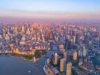Fototapeta premium Aerial view of modern city skyline and buildings at sunrise in Shanghai