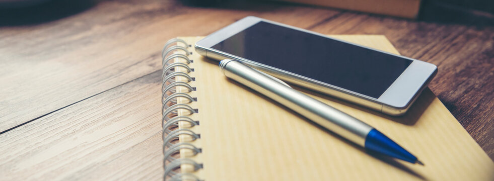 Diary and smartphone for Planner and organizer to plan and reminder daily appointment, meeting agenda, schedule, timetable and management, Work from home. Calendar reminder event Concept.