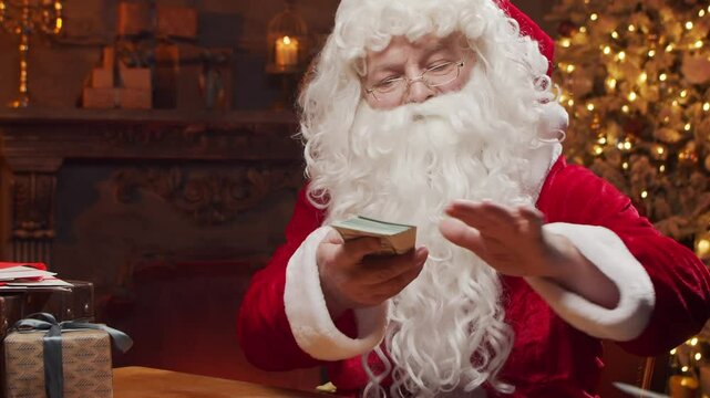 Santa Claus's workshop. Santa is busy wrapping a gift at the table, with a fireplace and Christmas tree in the background. A classic Christmas scene.