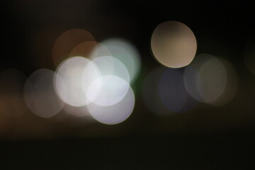A blurry dreamy view of lights in the night.