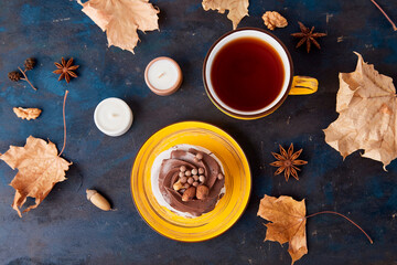 Aesthetics Chocolate Pavlova cake with Tea Cup background. Autumn tea time vibes flat lay