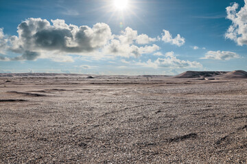 Desert sand ground and sky clouds natural landscape under the blue sky. car background.