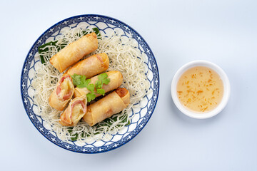 Crispy Spring Rolls with Dipping Sauce on White Background