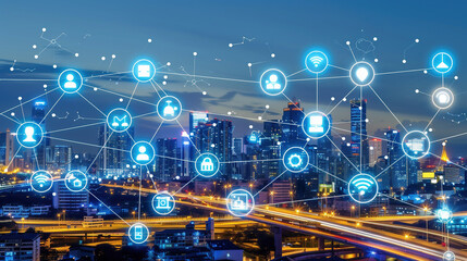City skyline at dusk with digital icons representing IoT. Blue gradient background. Concept of global connectivity technology