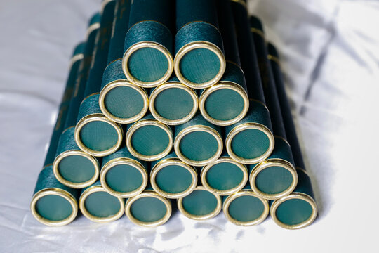 green velvet cardboard tubes stacked related to school graduation