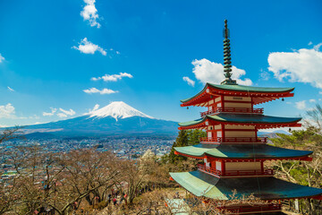Red pagoda Shimoyoshida shrine with snow on Fuji mountain