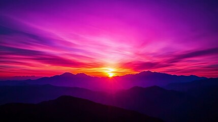 Obraz premium Majestic sunset over mountains, showcasing vibrant pink and purple hues. A perfect view for nature lovers and photographers.