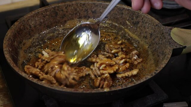 the process of caramelizing pecans in maple syrup to make pumpkin pie