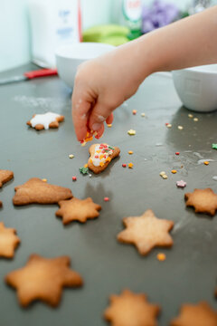 Child Baking German Christmas Biscuits At Home