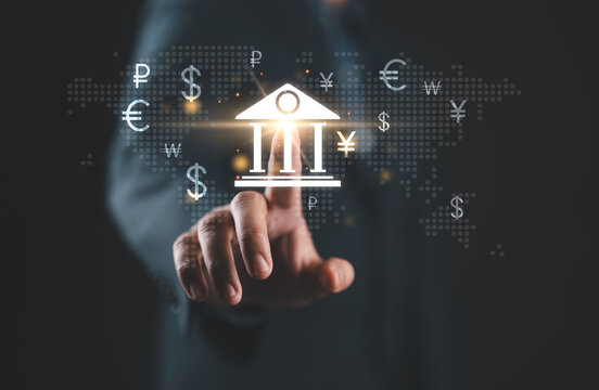 Global currency exchange concept, Businessman touch on bank world map and dollar yuan yen euro and pound sterling sign. Global business, international trading currency, world economy money, transfer.