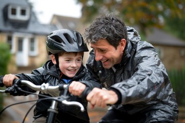 Loving father teaching his son to ride a bicycle in the outdoor