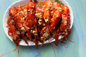 plate of traditional garlicky spicy sichuan red crawfish