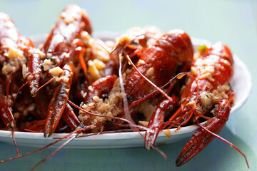 plate of traditional garlicky spicy sichuan red crawfish