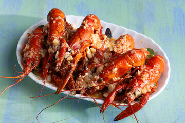 plate of traditional garlicky spicy sichuan red crawfish