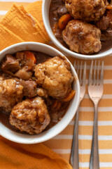 bowls of home made beef stew and dumplings English British food, comfort food, winter meal 