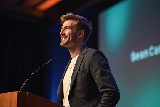 Confident Speaker Smiling Enthusiastically During Conference Presentation Against Colorful Stage Backdrop