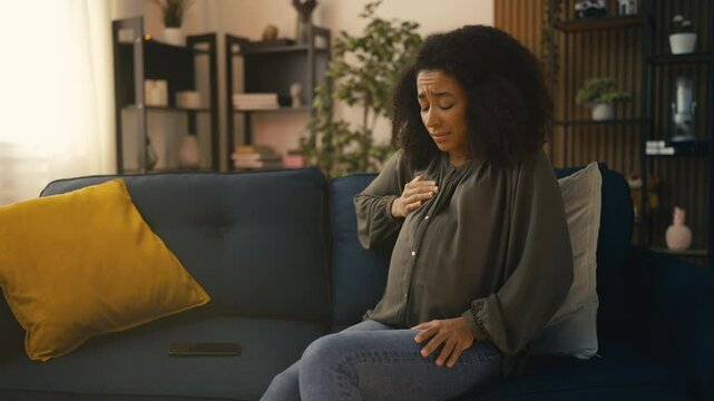 Young nervous pregnant woman feeling breast pain, hormonal imbalance, health