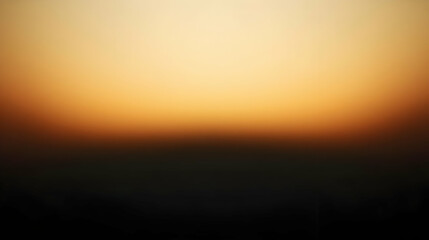 Obraz premium Blurred gradient black to ochre abstract background