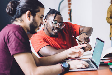 Modern students coworking on university project