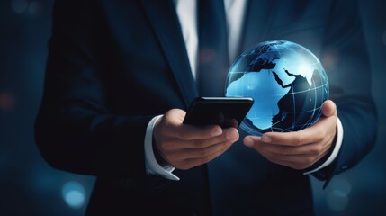A businessman in a suit holds a smartphone with a digital globe overlay, symbolizing global business connectivity and innovation.