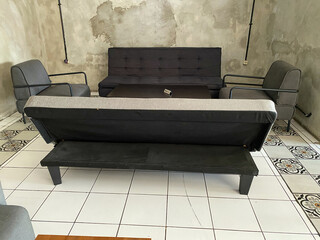 A minimalist living space with a multifunctional sofa