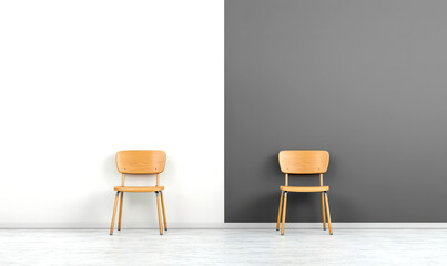 Two wooden chairs facing each other in a room with a white and grey wall.