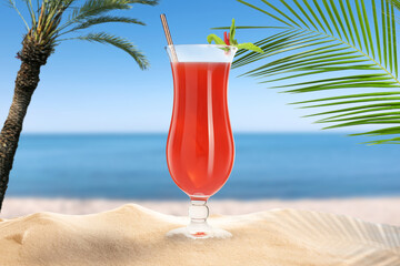Summer beach with delicious cocktail, palm trees and golden sand