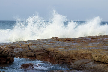 Waves breaking on the rocks located at Orange Rocks, Uvongo, Margate in South Africa